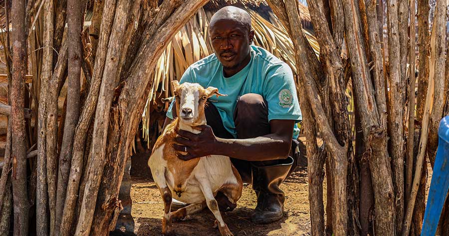 VWB-supported goat farmer with goat - Zoetis